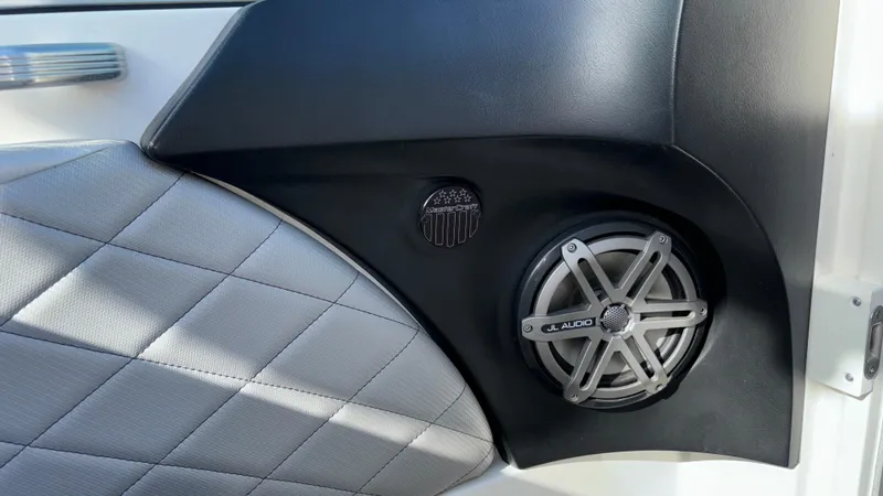 Slide: The Image of 2013 MasterCraft X55 interior speaker detail with quilted upholstery. - 23