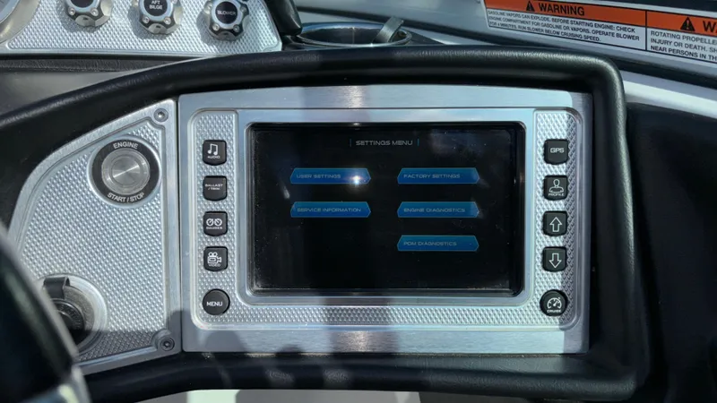 Slide: The Image of 2013 MasterCraft X55 boat dashboard with touchscreen control panel. - 35
