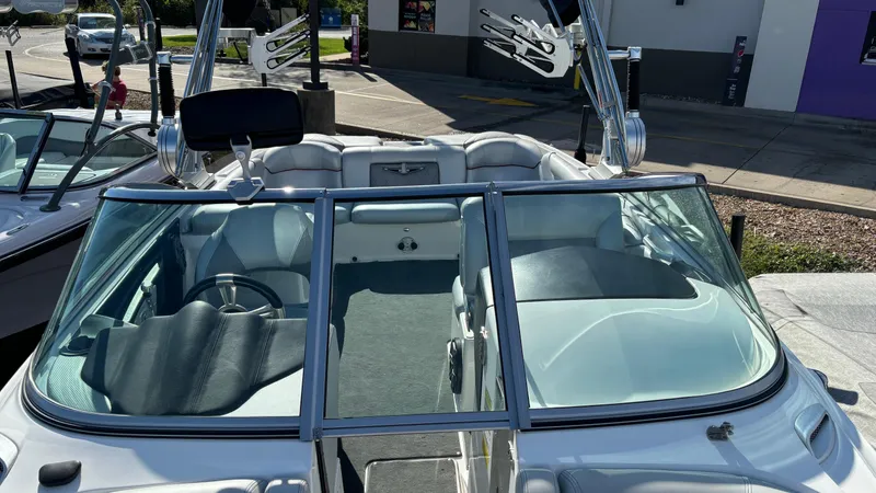 Slide: The Image of 2013 MasterCraft X55 boat interior with open windshield and seating. - 38