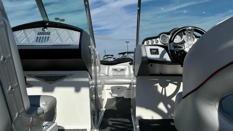 Slide: The Image of Interior of a 2013 MasterCraft X55 boat with modern dashboard and seating. - 41