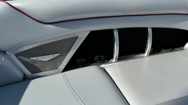 Slide: The Image of 2013 MasterCraft X55 boat interior with sleek seating and cup holders. - 45