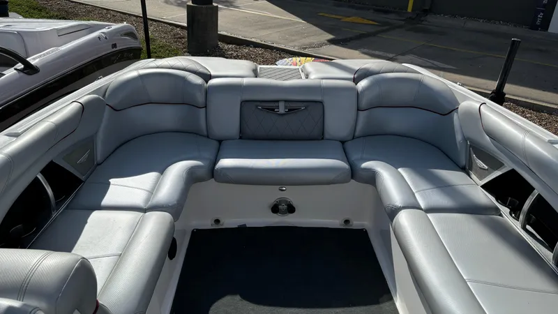 Slide: The Image of 2013 MasterCraft X55 boat interior with gray leather seating. - 9