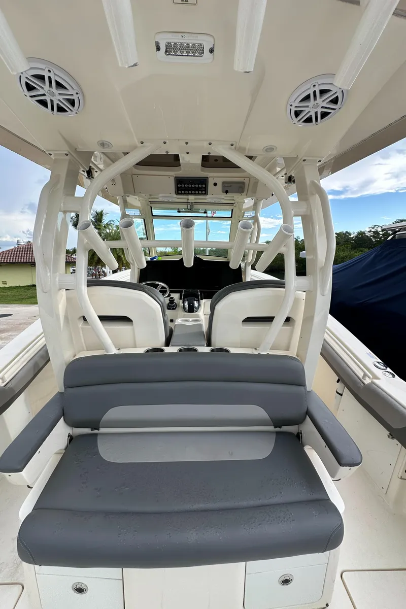 Slide: The Image of 2017 Scout 350 LXF boat interior with seating and helm, showcasing modern design. - 16