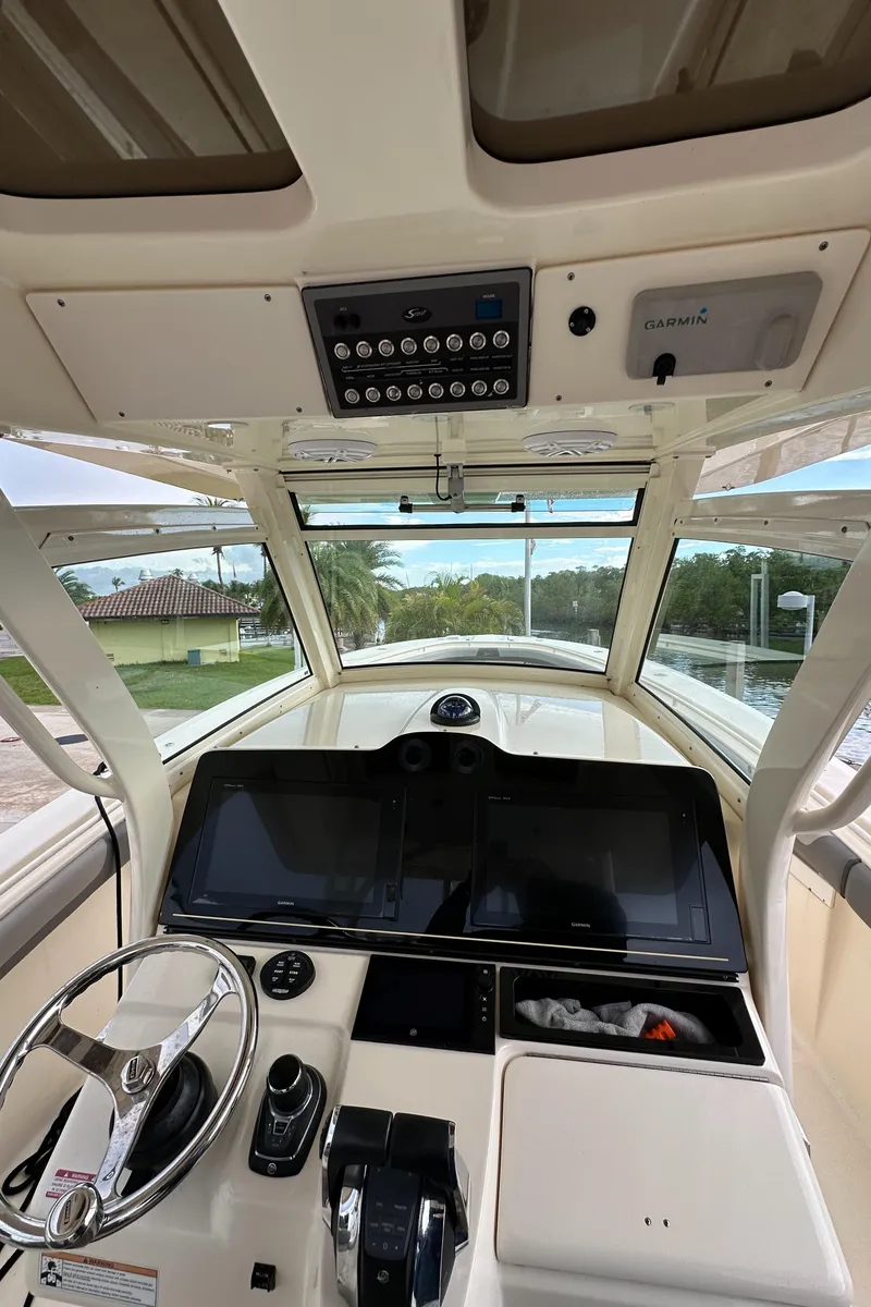 Slide: The Image of 2017 Scout 350 LXF boat cockpit with modern controls and steering wheel. - 18