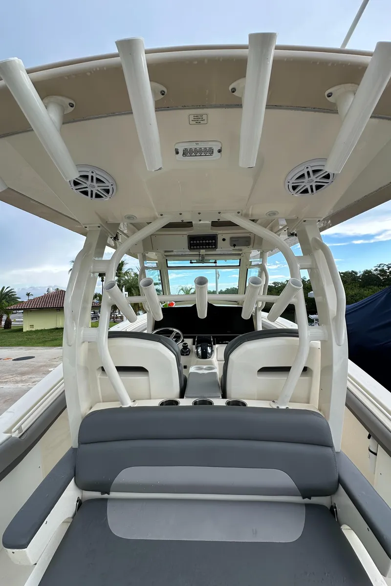 Slide: The Image of 2017 Scout 350 LXF boat interior with rod holders and seating. - 30