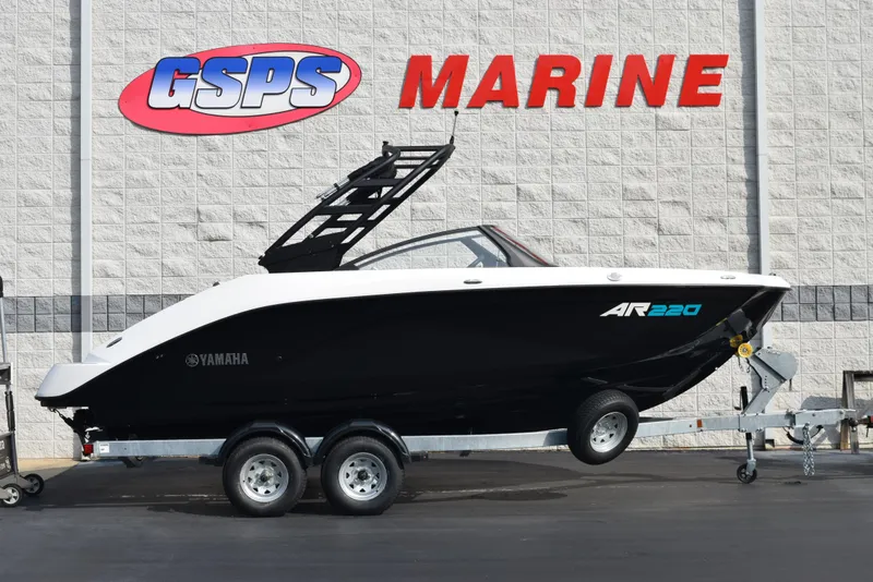 The Image of 2025 Yamaha AR220 boat on trailer at GSPS Marine dealership. - 1