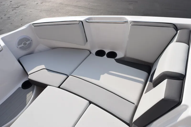 Slide: The Image of 2025 Yamaha Boats AR220 interior seating with sleek, modern design and comfortable cushions. - 14