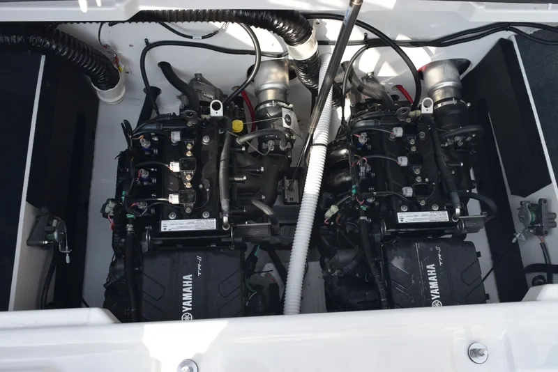 Slide: The Image of 2025 Yamaha AR220 boat engine compartment with dual engines. - 17