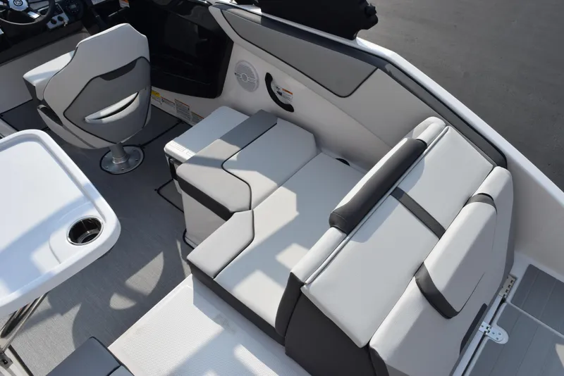 Slide: The Image of 2025 Yamaha Boats AR220 interior with modern seating and sleek design. - 8