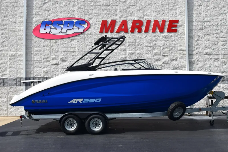 The Image of 2025 Yamaha AR250 boat on trailer at GSPS Marine dealership. - 1