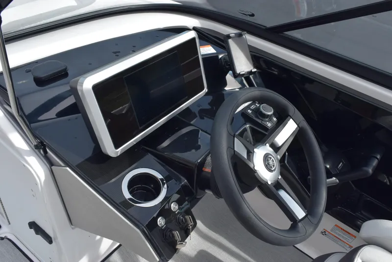 Slide: The Image of 2025 Yamaha AR250 boat dashboard with steering wheel and touchscreen display. - 14
