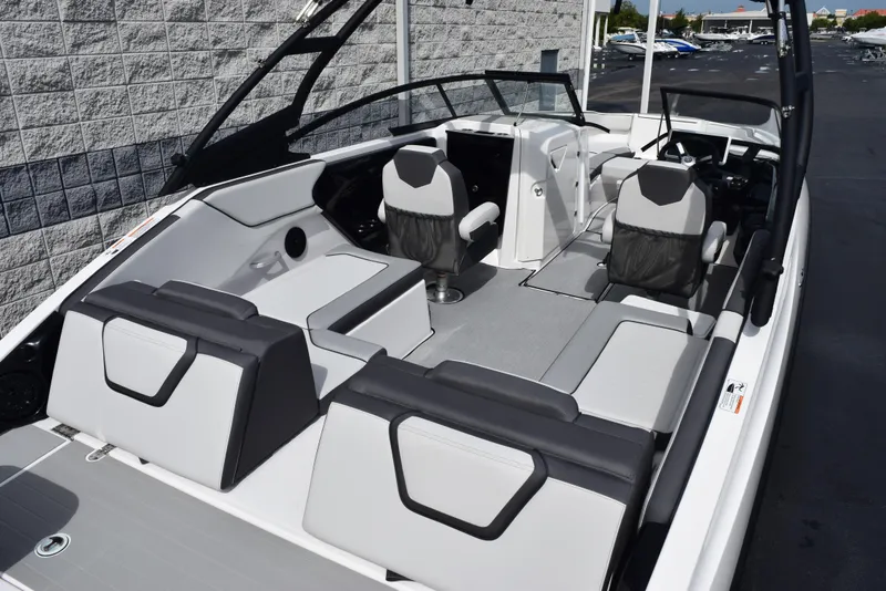 Slide: The Image of 2025 Yamaha Boats AR250 interior with modern seating and sleek design. - 8