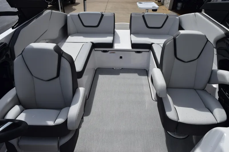 Slide: The Image of 2025 Yamaha Boats AR250 interior with modern seating and sleek design. - 9