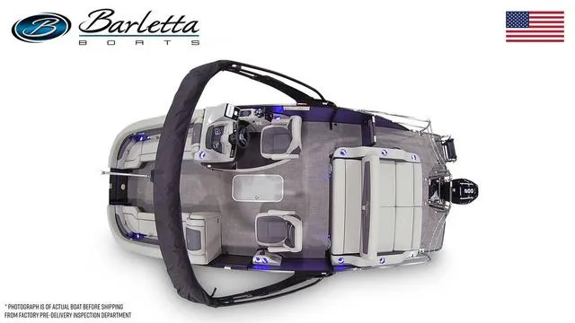 Slide: The Image of Top view of 2025 Barletta Cabrio C24UC boat with seating and helm, American flag displayed. - 7