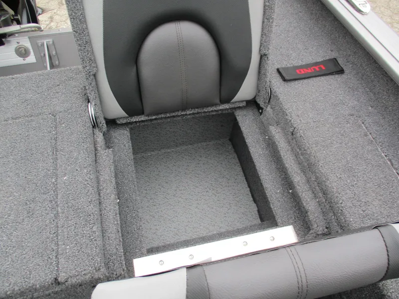 Slide: The Image of 2025 Lund Impact XS 1775 Sport boat interior storage compartment. - 16