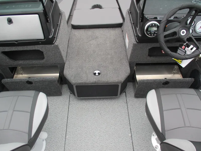 Slide: The Image of 2025 Lund Impact XS 1775 Sport boat interior with storage compartments and seating. - 17
