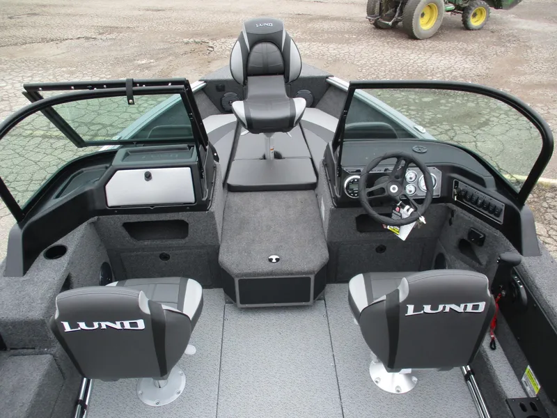 Slide: The Image of Interior of 2025 Lund Impact XS 1775 Sport boat with seating and steering console. - 3
