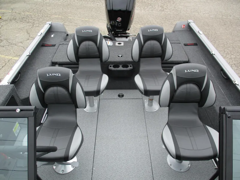 Slide: The Image of 2025 Lund Impact XS 1775 Sport boat interior with four gray seats. - 7