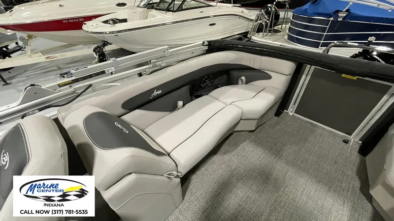 Slide: The Image of 2025 Barletta Aria A22QC boat interior with plush seating at Marine Center Indiana. - 16