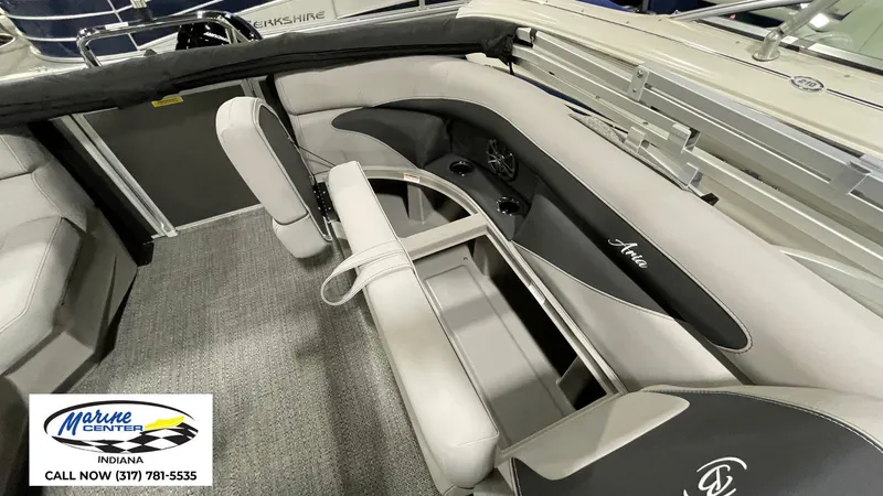 Slide: The Image of 2025 Barletta Aria A22QC boat interior with gray seating and cup holders. - 18