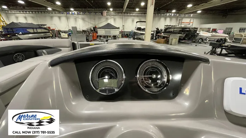 Slide: The Image of Dashboard of 2025 Barletta Aria A22QC boat in showroom setting. - 19