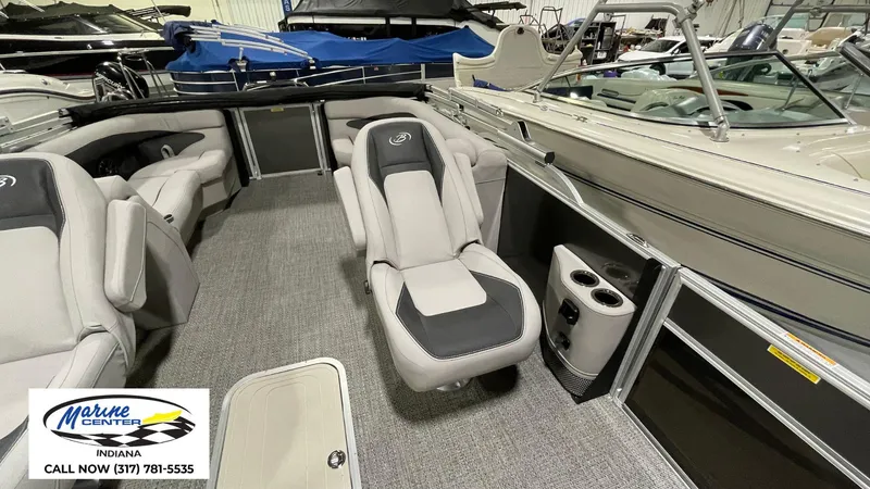 Slide: The Image of 2025 Barletta Aria A22QC boat interior with plush seating and modern design. - 4
