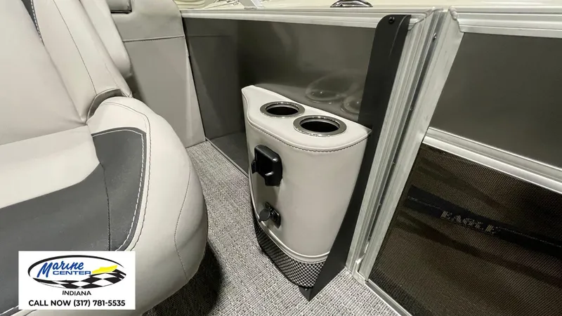 Slide: The Image of 2025 Barletta Aria A22QC boat interior with cup holders and seating detail. - 5