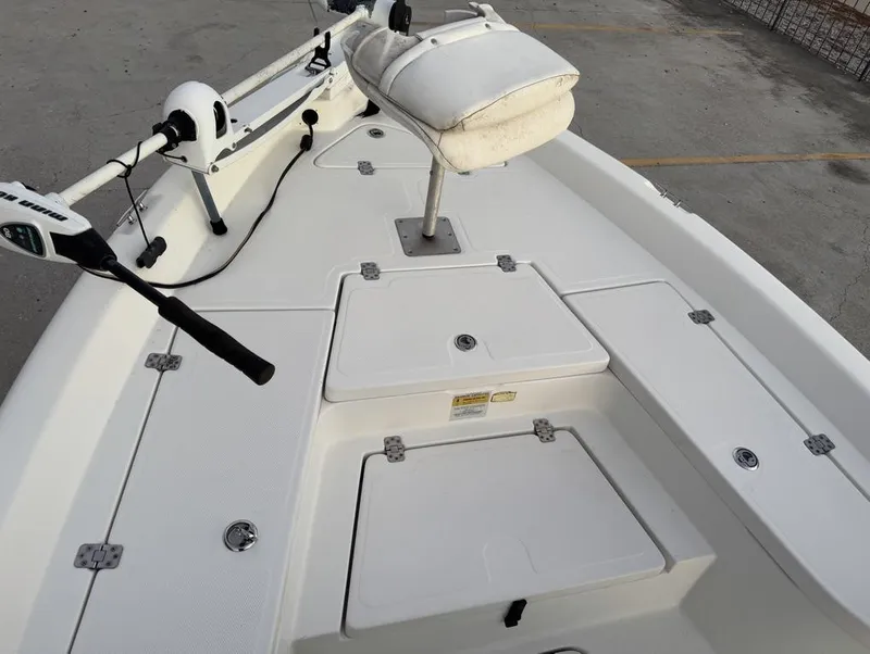 Slide: The Image of 2014 NauticStar NauticBay 214 XTS SB boat deck with seating and storage compartments. - 15