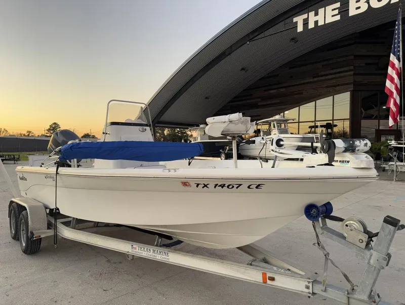 Slide: The Image of 2014 NauticStar NauticBay 214 XTS SB boat on trailer, parked outside dealership. - 5