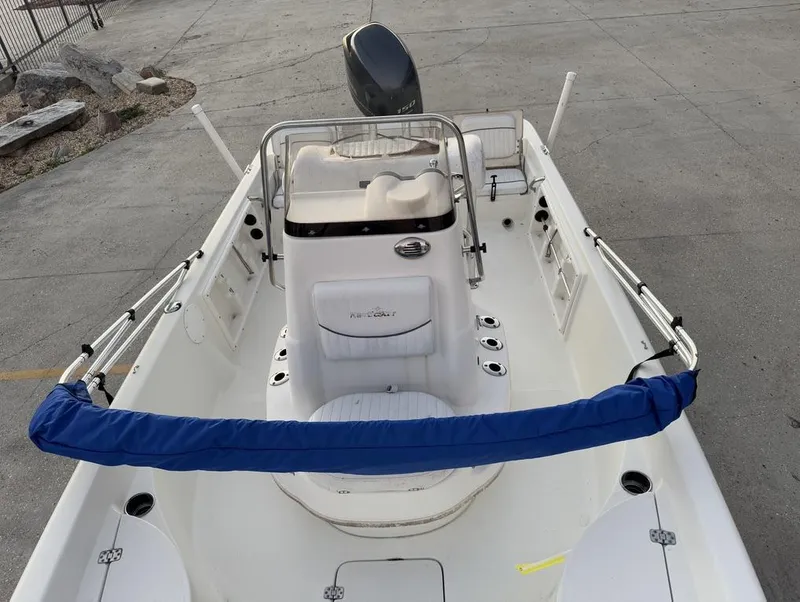 Slide: The Image of 2014 NauticStar NauticBay 214 XTS SB boat interior with seating and console. - 8