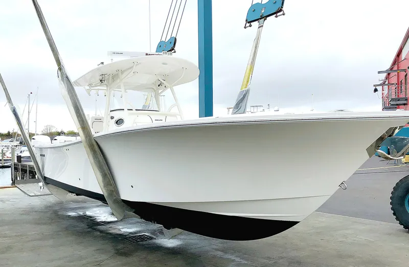 Slide: The Image of 2016 Regulator 34 boat on lift at marina. - 0
