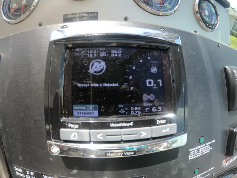 Slide: The Image of Mercury VesselView display on 2015 Sea Ray 330 Sundancer dashboard, showing engine data. - 16