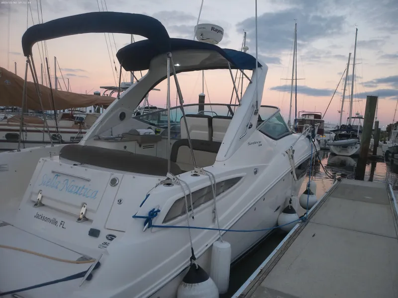 Slide: The Image of 2015 Sea Ray 330 Sundancer docked at marina during sunset. - 22