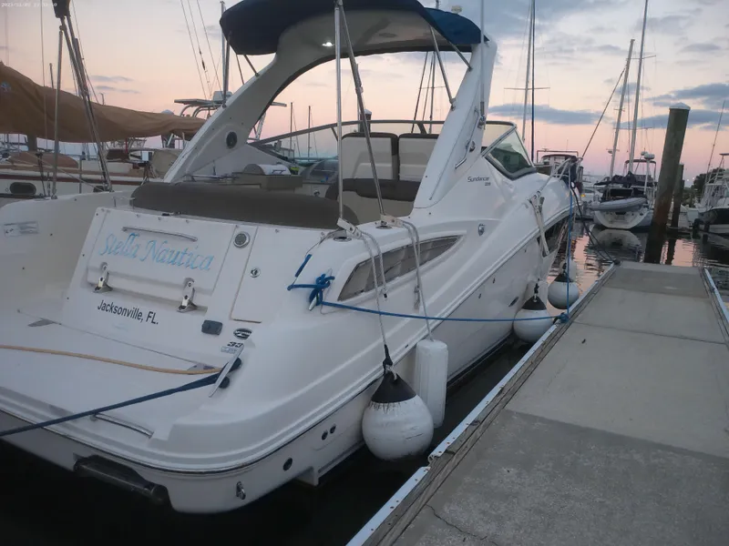 Slide: The Image of 2015 Sea Ray 330 Sundancer docked at marina, Jacksonville, FL, during sunset. - 26