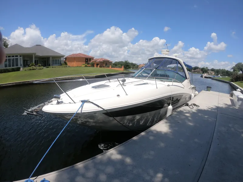 Slide: The Image of 2015 Sea Ray 330 Sundancer docked on a sunny day. - 3