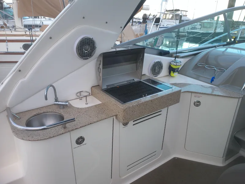 Slide: The Image of 2015 Sea Ray 330 Sundancer yacht with outdoor kitchen and grill. - 31
