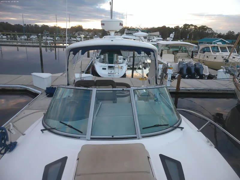 Slide: The Image of 2015 Sea Ray 330 Sundancer docked at marina during sunset. - 37