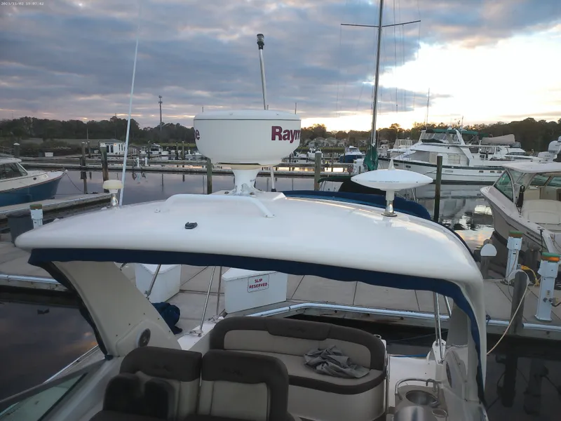 Slide: The Image of 2015 Sea Ray 330 Sundancer docked at marina during sunset. - 38