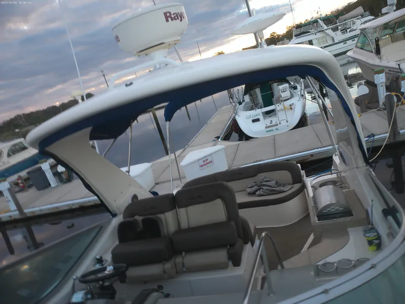 Slide: The Image of 2015 Sea Ray 330 Sundancer at marina, featuring spacious seating and modern design. - 39