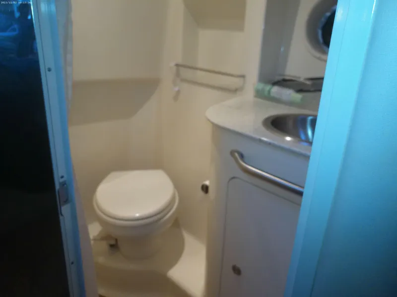 Slide: The Image of 2015 Sea Ray 330 Sundancer bathroom with toilet and sink. - 42