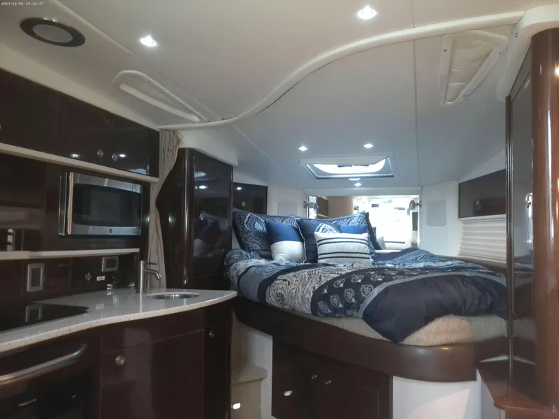 Slide: The Image of Luxurious interior of 2015 Sea Ray 330 Sundancer yacht with cozy bed and modern amenities. - 46