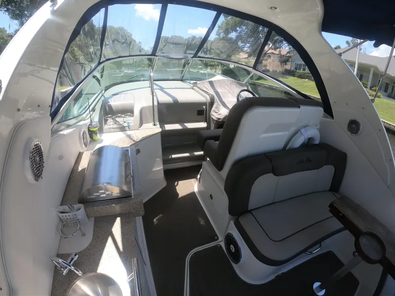 Slide: The Image of Interior of 2015 Sea Ray 330 Sundancer boat with seating and helm. - 5