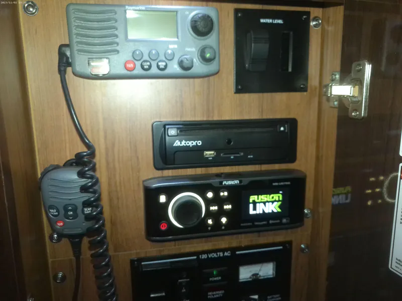 Slide: The Image of Control panel of a 2015 Sea Ray 330 Sundancer with radio and audio systems. - 50