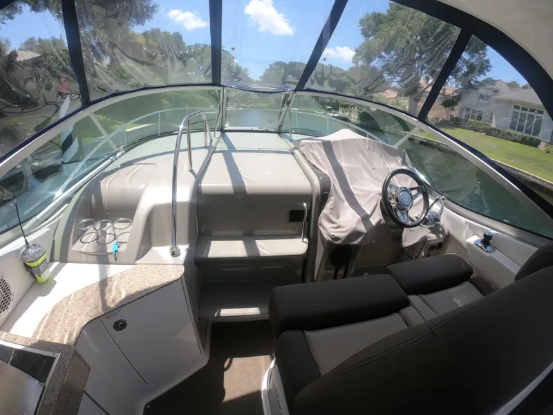 Slide: The Image of Interior of 2015 Sea Ray 330 Sundancer boat with modern helm and seating. - 8