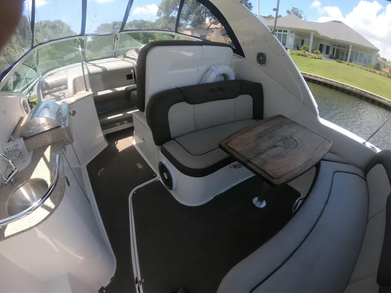 Slide: The Image of Interior of 2015 Sea Ray 330 Sundancer boat with seating and table. - 9