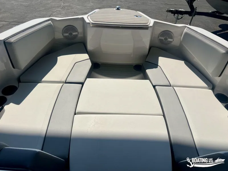 Slide: The Image of 2025 Yamaha AR220 boat interior with cushioned seating and built-in speakers. - 14