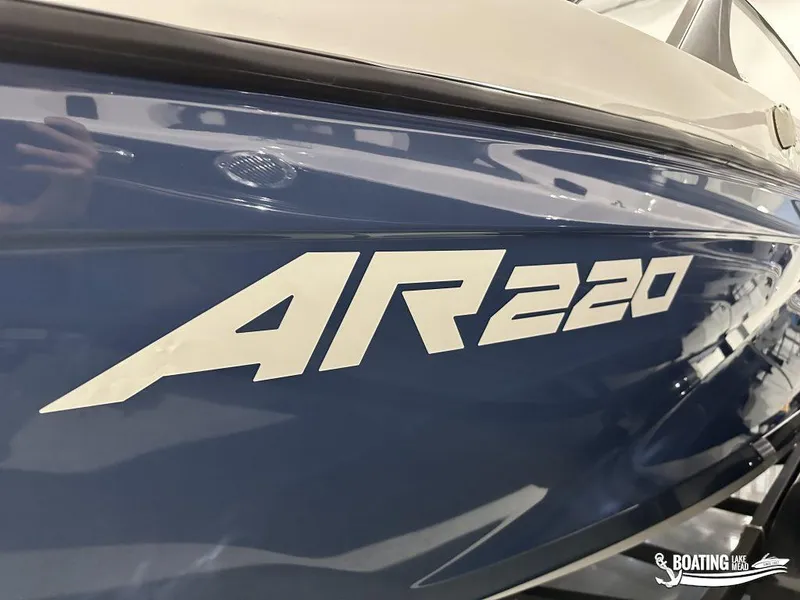 Slide: The Image of 2025 Yamaha AR220 boat side view with bold lettering. - 2