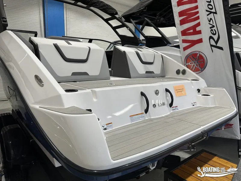Slide: The Image of 2025 Yamaha AR220 boat rear view with swim platform and seating. - 3