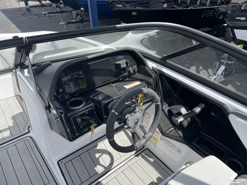Slide: The Image of 2025 Yamaha Boats 195S cockpit with steering wheel and control panel. - 10