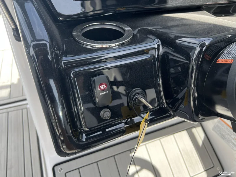 Slide: The Image of Control panel of 2025 Yamaha Boats 195S with blower switch and key ignition. - 12